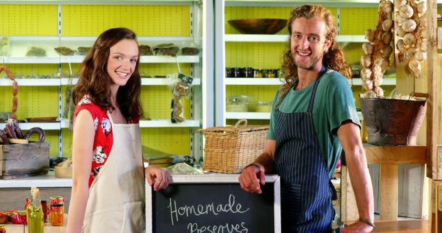 Smiling couple selling homemade preserves in artisanal store - Download Free Stock Images Pikwizard.com