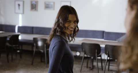 Smiling Colleagues Engaging in Office Discussion Gathering