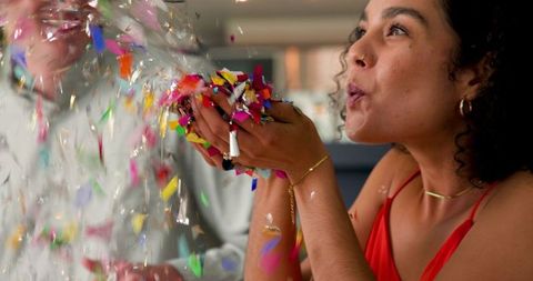 Joyful Celebration with Confetti Feat Multiracial Couple
