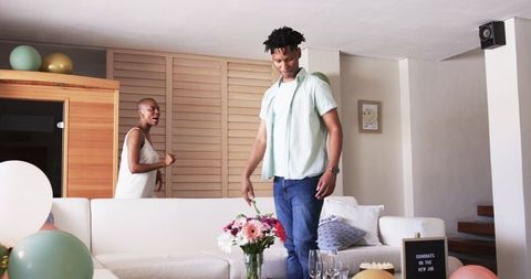 Joyful Home Celebration for New Job with Friends and Balloons