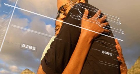 Embracing couple on cliff at dusk with futuristic HUD overlay and warm golden light