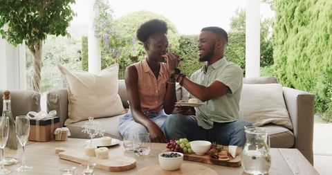 Happy Couple Sharing Dessert on Scenic Patio