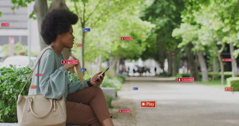 Woman Interacting with Digital Icons in Park Setting