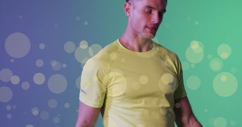 Male Tennis Player Standing with Overlay of Abstract Spots