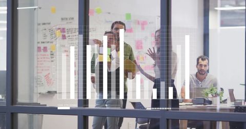 Business Team Analyzing Graph Data at Office Meeting