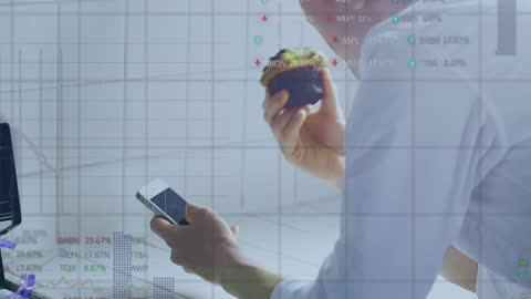 Businessman Analyzing Data on Smartphone with Food in Hand