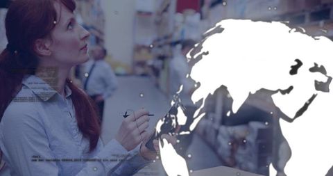 Redhead warehouse inspector noting inventory on tablet with global map overlay in aisle