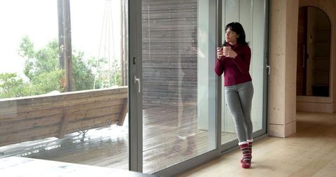 Serene moment of reflection indoors on a rainy day