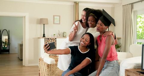 Diverse Female Friends Celebrating Graduation with Selfie
