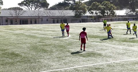 Youth soccer match focused on teamwork and energy