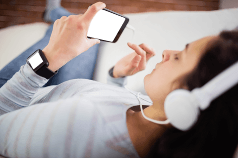 Transparent Smartwatch and Smartphone Use While Listening to Music at Home - Download Free Stock Videos Pikwizard.com