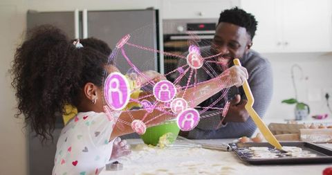 Family baking together with floury daughter playing with dough and glowing network hologram