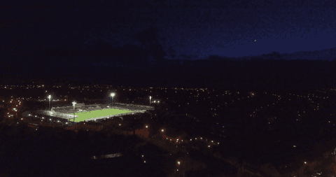illuminated sports field night aerial in vibrant cityscape - Download Free Stock Videos Pikwizard.com