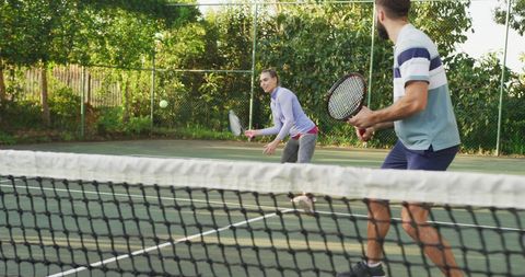Active Caucasian Woman Playing Tennis with Partner on Outdoor Court - Download Free Stock Images Pikwizard.com
