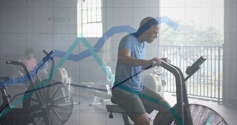 Man training on elliptical with overlaid data graph at gym