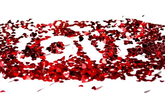 Heart-shaped confetti forming the word 'LOVE', captured in an elegant cascade against a white backdrop. This celebratory and romantic arrangement is perfect for Valentine's Day advertising, romantic occasion designs, greeting cards, wedding invitations, or any project emphasizing love and celebration.