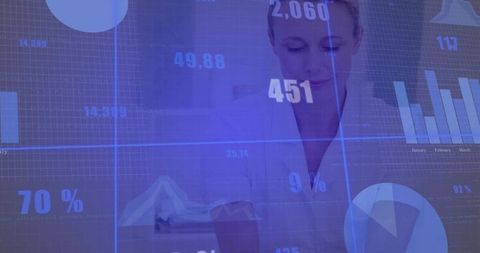 Mature woman analyzing digital dashboard with blue data overlays and business charts