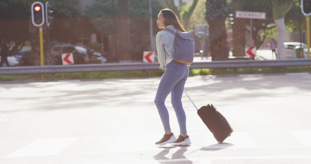 Young Woman with Backpack and Suitcase Crossing Street in Urban Area - Download Free Stock Images Pikwizard.com