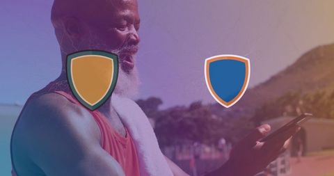 Elderly Athlete Watching Sports Content on Phone in Summer