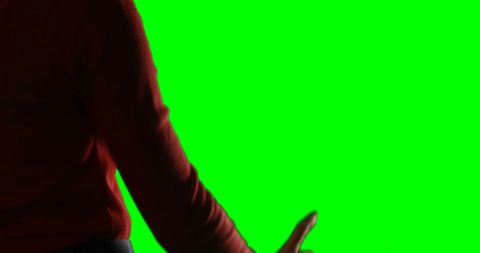 Woman Pretending to Interact with Invisible Interface on Green Screen