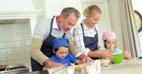Caucasian Family Bonding Over Baking in Home Kitchen