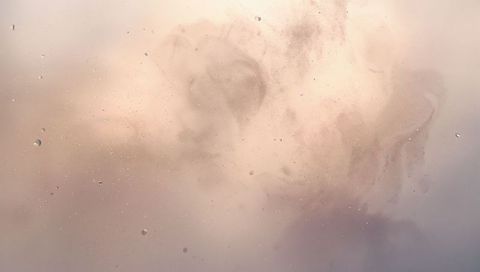 Smudged translucent glass revealing droplets, ring stains and pastel gradient backlight