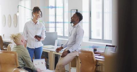 Team Discussing Work in Bright Modern Office