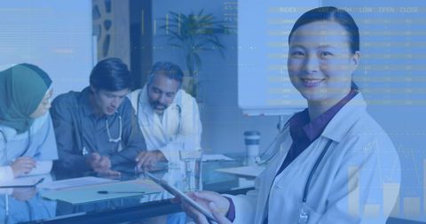 Woman Doctor Using Tablet with Diverse Medical Team in Discussion - Download Free Stock Images Pikwizard.com
