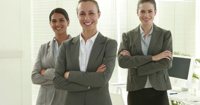 Confident Businesswomen in Suits Smiling in Office - Download Free Stock Images Pikwizard.com