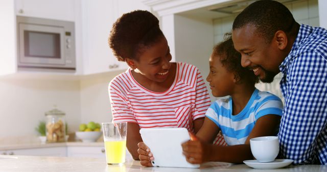 Happy African American Family Using Digital Tablet in Kitchen - Download Free Stock Images Pikwizard.com