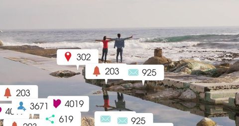 Couple Connecting by Ocean with Social Media Notifications