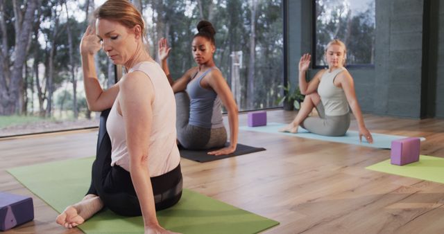 Diverse Women Practicing Yoga in Modern Studio - Download Free Stock Images Pikwizard.com