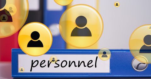Personnel management icons hovering over office binder