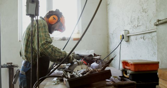 Factory Worker Using Tools on Metal Project in Workshop - Download Free Stock Images Pikwizard.com