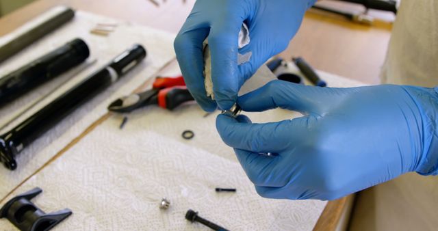 Technician assembling bicycle handlebars with blue gloves on. Ideal for content related to bicycle repair, maintenance guides, mechanic tutorial, precision work, cycling equipment, or technician promotional materials.