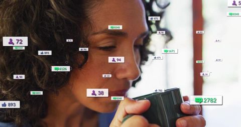 Mature woman sipping coffee at home with floating social media notifications overlay