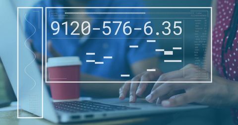 Diverse Team Analyzing Data with Digital Interface in Office Environment