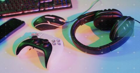 Gaming Gear on Desk with Illuminated Neon Lights - Download Free Stock Images Pikwizard.com