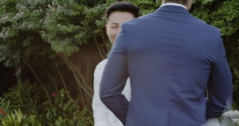 Joyful Reunion at Wedding Celebration Outdoors