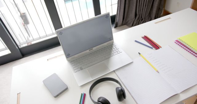 Minimalist Workstation with Laptop and Notepad in Bright Room - Download Free Stock Images Pikwizard.com