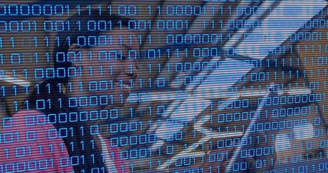 Commuter riding escalator with binary code overlay representing digital transit security