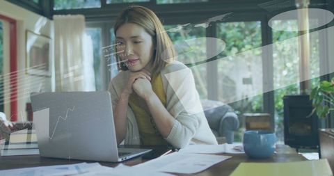 Caucasian Woman Analyzing Financial Data on Laptop at Home - Download Free Stock Images Pikwizard.com