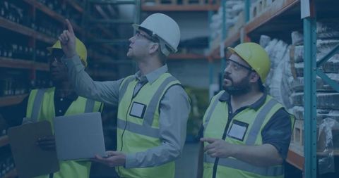 Team of Workers Managing Inventory in Warehouse Aisle