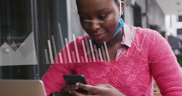 Young Woman Analyzing Data on Smartphone and Laptop at Outdoor Cafe - Download Free Stock Images Pikwizard.com