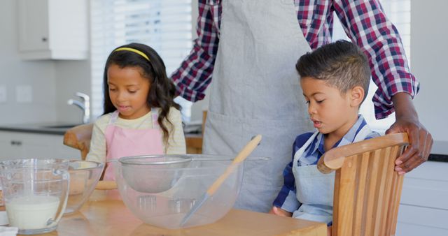 Father teaching children kitchen baking activities - Download Free Stock Images Pikwizard.com