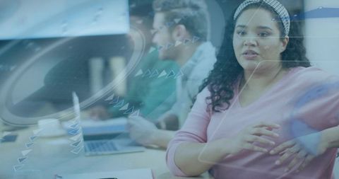 Woman leading meeting discussion with digital hud overlay and modern collaborative workspace