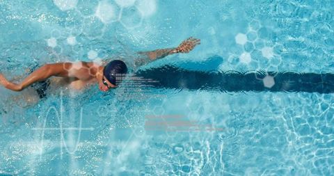 Professional swimmer performing freestyle stroke in pool