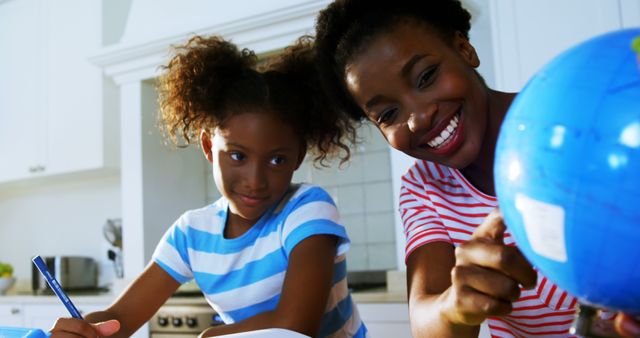 Happy Mother and Daughter Learning Together at Home - Download Free Stock Images Pikwizard.com