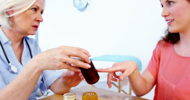 Female Doctor Consulting Young Patient About Prescription Medication - Download Free Stock Images Pikwizard.com