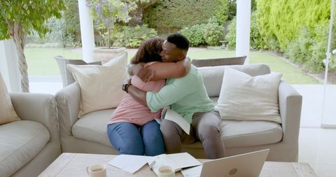 Couple Celebrating Victory with Joyful Hug